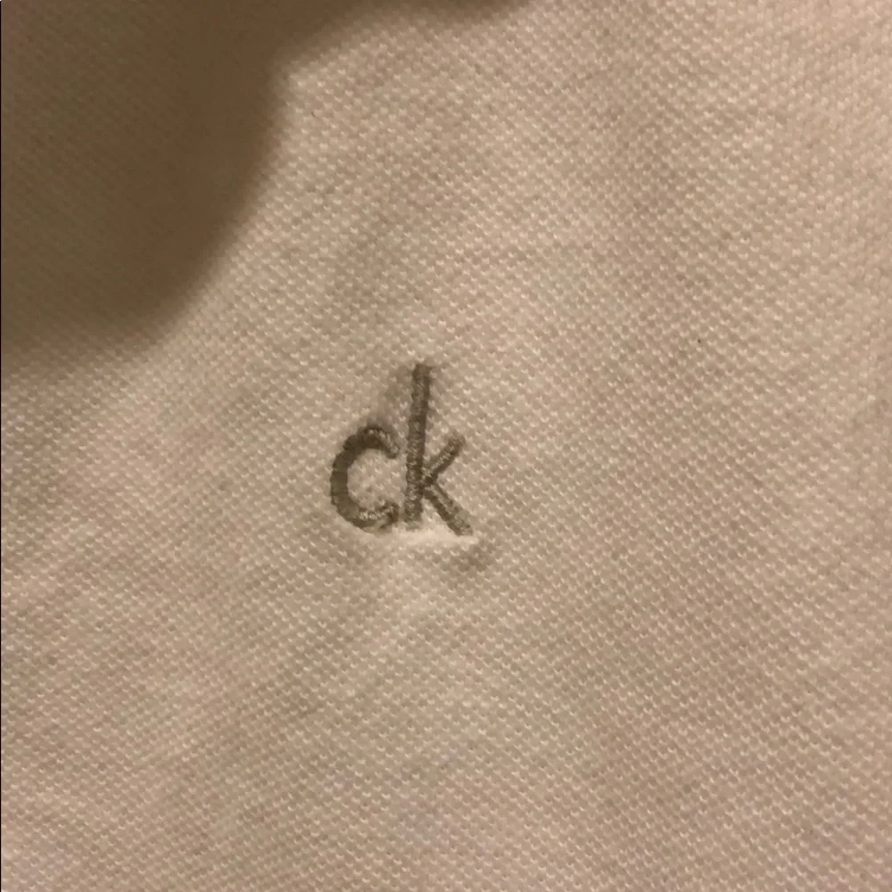 White Calvin‎ Klein kids short sleeve polo size LG